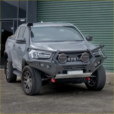 Gray toyota hilux widebody ute with rockarmor gt hoop bullbar combo pack featuring rugged front bumper and offroad lights
