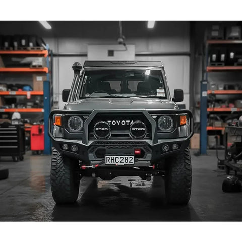 Dark gray toyota landcruiser 70 series with rockarmor gt hoop steel bullbar full bar replacement for offroad 4wd ute