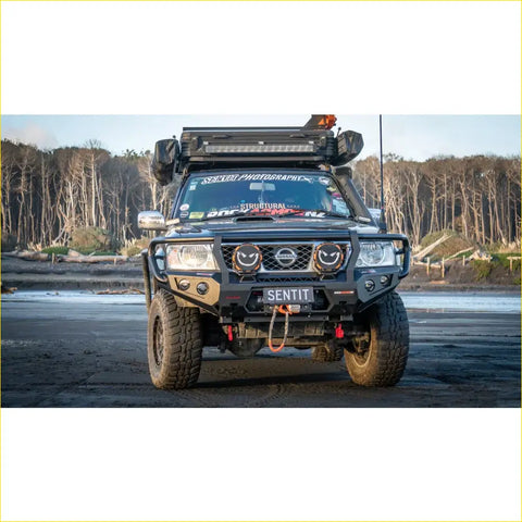 Black nissan patrol with rockarmor gt hoop bullbar combo roof rack and rugged offroad 4wd features