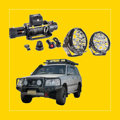 Silver toyota land cruiser with black steel rockarmor gt hoop bullbar combo and roof rack for 100 series 98 07