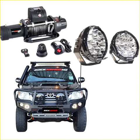 Black Toyota Hilux ute with Rockarmor gt hoop steel bullbar combo, rockarmor front bumper, roof rack, and offroad lights for 4wd use