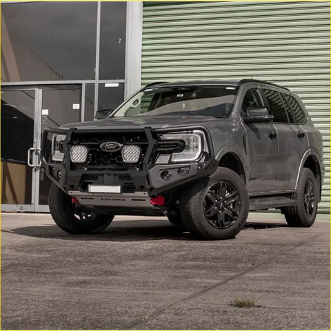 Dark gray ford ranger with black steel rockarmor gt hoop bullbar and offroad bumper for 4wd ute use