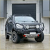 Black isuzu d-max with rockarmor gt hoop steel bullbar rugged front bumper roof rack and off-road tires