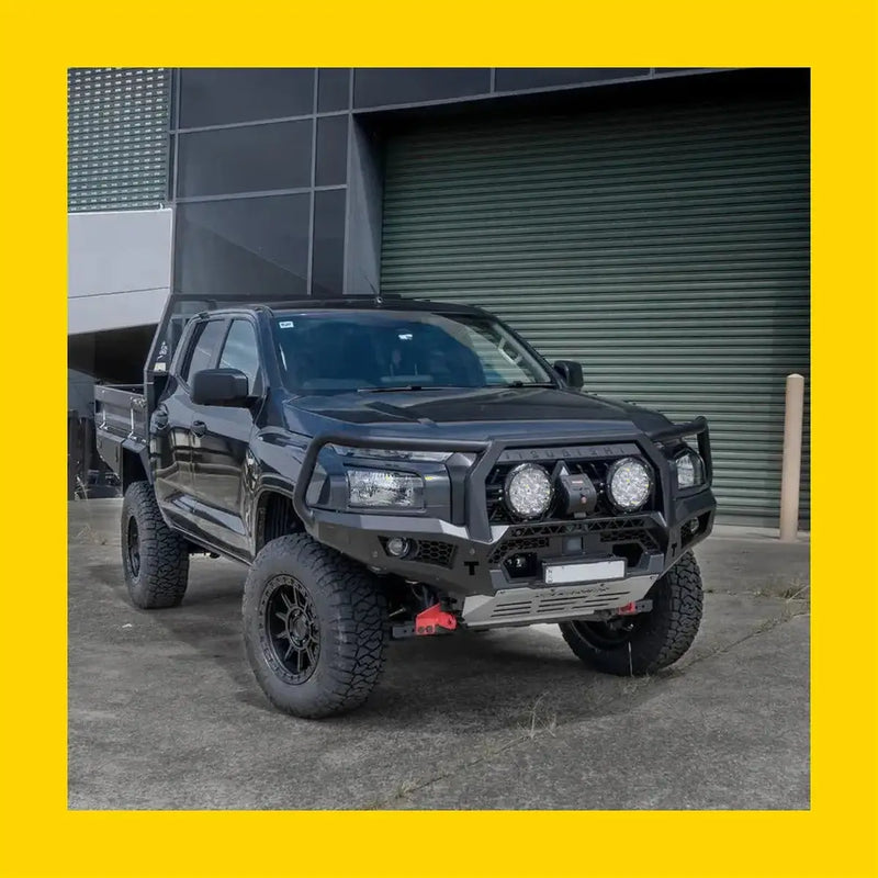 Black rockarmor gt hoop steel bullbar on lifted mitsubishi mv triton 2024 with off-road tires and heavy-duty front bumper