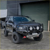 Black lifted Mitsubishi mv triton 2024 with rockarmor gt hoop steel bullbar rugged off-road tires and three auxiliary lights