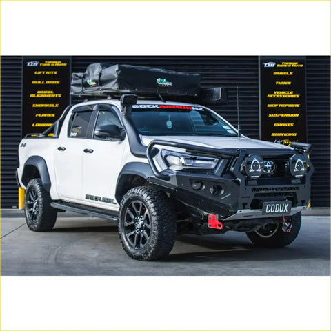 White toyota hilux ute with black steel rockarmor gt hoop bullbar and roof rack for offroad 4wd use