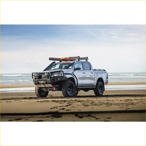 Silver toyota hilux ute with black rockarmor gt hoop steel bullbar offroad 4wd accessories and roof rack