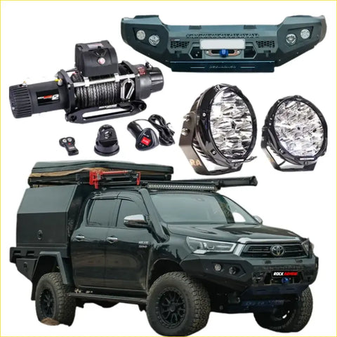Black Toyota Hilux 4wd ute with Rockarmor GT steel hoopless bullbar combo, rugged bumper, roof rack, and offroad tent