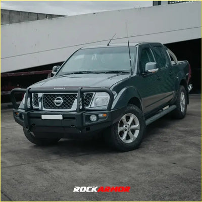 Black nissan frontier ute with rockarmor premium steel bullbar front bumper guard and silver alloy wheels for offroad 4wd