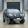 Black isuzu d-max 2017-2020 with rockarmor rock pack featuring gt hoop bullbar roof rack and rock sliders for off-road use