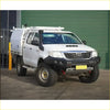 White toyota hilux pickup with black gt hoopless bullbar roof rack and rock sliders from rockarmor rock pack
