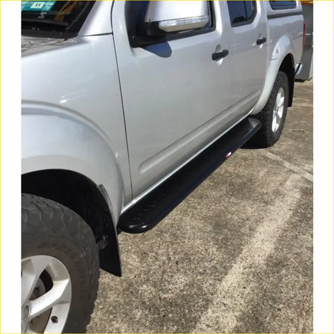 Black textured steel rockarmor rockslider side step for silver nissan navara d40 ute ideal for 4wd offroad use