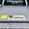 Gray textured roll bar t10 truck bed cover with metallic handle and black best truck bed covers label for ford ranger 2022+