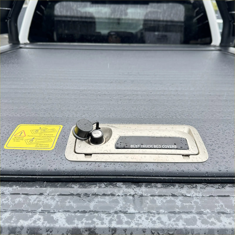 Gray textured roll bar t10 truck bed cover with metallic handle and black best truck bed covers label for ford ranger 2022+