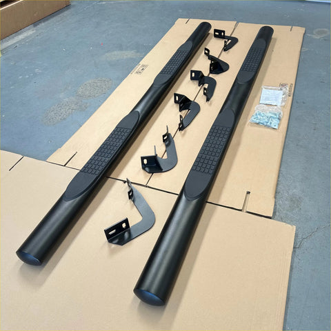 Black textured 4 inch oval tube running board side step bars with integrated mounting brackets for bt50 12-20