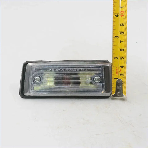 Rectangular clear lens side marker light with black rubberized housing and silver screws for toyota hilux 1972-1978