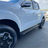 Silver metallic side step running board oem style on white nissan navara 2015-current double cab pickup truck