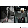 Silver shift knob extension for manual gear shifter lever with shiny metallic finish and textured grip on silver shaft