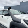 Black rubber snorkel mounted on the front of white isuzu pickup truck for snorkel toyota hilux 2015-2025 use