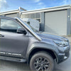 Shiny chrome bull bar mounted on gray toyota hilux with stainless steel snorkel for 2015-2025 models