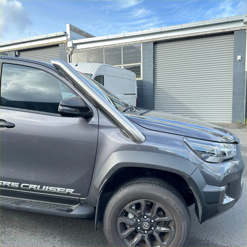Shiny chrome bull bar mounted on gray toyota hilux with stainless steel snorkel for 2015-2025 models