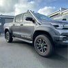 Gray metallic toyota hilux sr5 cruiser pickup with black alloy wheels and stainless steel roof-mounted snorkel for 2015-2025 models