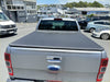 Silver ford pickup truck back with black soft tonneau cover for mazda bt50 2012-2020 double cab