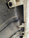 Rusty metallic undercarriage panel with bolts and clips for nissan navara np300 2016 inox back side view