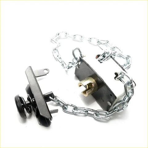 Black metal door chain lock with silver links and brass locking mechanism on spare wheel carrier for toyota hilux double cab