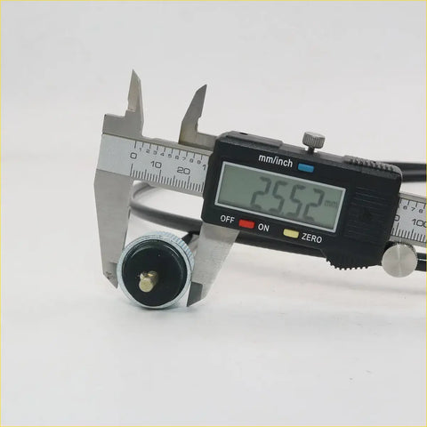 Black digital caliper measuring silver and black cylindrical speedometer cable for nissan datsun 510 bluebird sss 1600