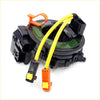 Black plastic airbag pretensioner with yellow wiring and orange connectors for spiral cable clock spring mitsubishi galant endeavor