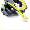 Black plastic spiral cable clock spring with yellow and black wires green connectors and white circular part for mitsubishi pajero
