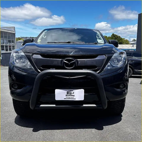 Black mazda bt-50 pickup with matte black stainless steel nudge bar and rugged front bumper guard from 2012-2020