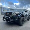 Black nissan navara 2021+ with stainless steel medium size nudge bar rugged front bumper and black alloy wheels