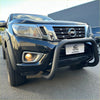 Black nissan np300 pickup with a matte black stainless steel nudge bar and rugged front bumper guard