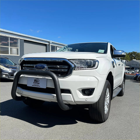 White ford ranger pickup truck with black steel front bumper guard featuring stainless steel nudge bar for ranger px1/2/3