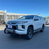 White mitsubishi triton pickup with black front bumper guard and chrome accents featuring stainless steel nudge bar