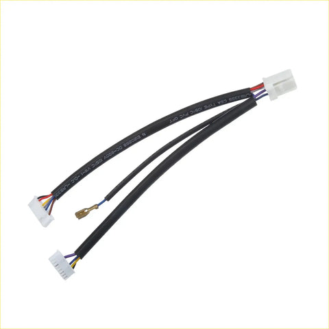 Black insulated electrical cable with multiple colored wires and white connectors for steering wheel cruise volume control switch on toyota land cruiser prado back side