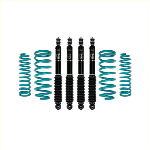 Set of four black sfi shock absorbers with teal coil springs for suzuki jimny gj 5 door 2023 on dobinsons lift kit