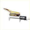 A metallic lever latch with yellowish patina and spring for tail gate handle opener on nissan datsun navara d21