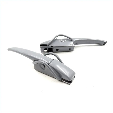 Gray plastic-handled industrial strap clamps with metallic jaws for tail gate handle opener locker toyota hilux 2004-2015