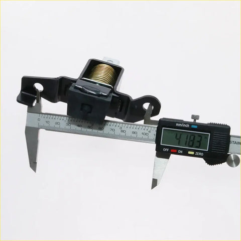 Black plastic tail gate lock latch with gold spring coil and metal brackets for nissan navara d21 king cab 1986-1997