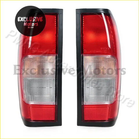 Back side of black framed red and clear textured lens tail light assembly for nissan navara d22 1997-2015