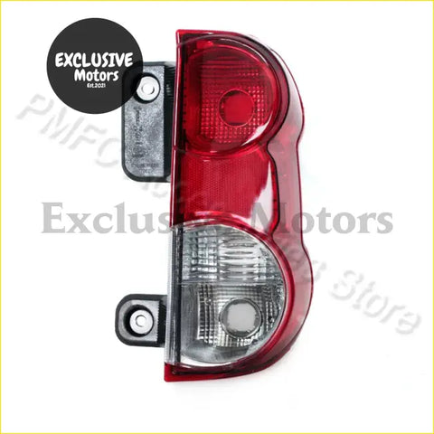 Red plastic tail light for nissan nv200 2009-2015 with clear lens section and black mounting brackets shown from back side