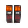 Pair of black-framed rectangular tail lights with amber clear and red lenses for toyota hilux 1978-1983