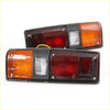 Black rectangular trailer tail lights with amber red and clear lenses for brake light on toyota hilux 1978-1983 back side