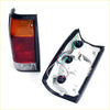 Black plastic tail light assembly with red and amber lenses for mazda b2000 b2200 b2600 1985-1998 back side view