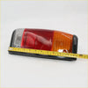 Black plastic tail light assembly with red amber and clear lenses for Mazda B2000 B2200 B2600 1985-1998 back side view