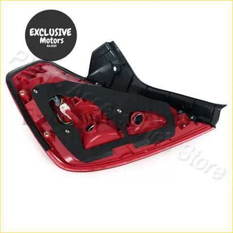 Backside view of red and black plastic tail lights with visible wiring for 2006-2007 nissan teana
