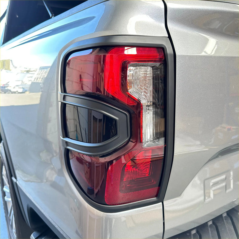 Taillight covers for ford ranger 2022 plus show back side with sleek red and clear lenses in matte black plastic bezel